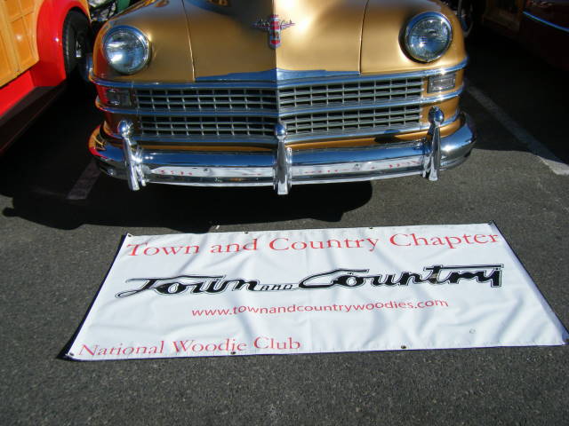 T&C Banner in front of Luanne Esposito's gold T&C